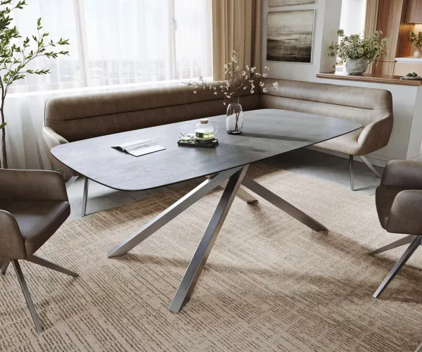 DELIFE Jedálenský stôl Edge zaoblený 200x100 cm keramika betónová sivá krížová podstava obdĺžniková nerezová oceľ